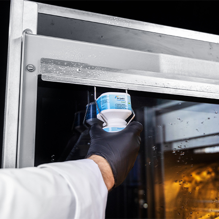 placing fri-jado detergent in the rotisserie