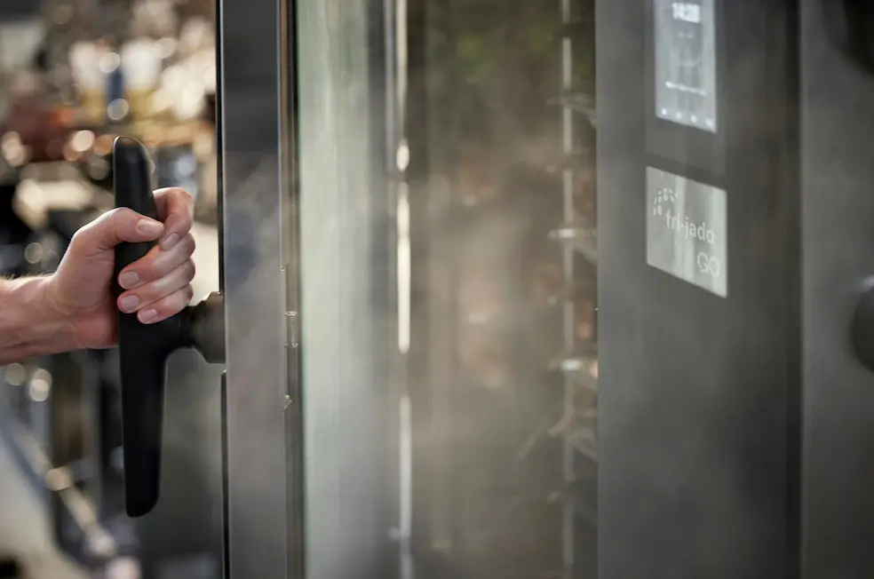 opening a frijado GO combi oven with steam coming out