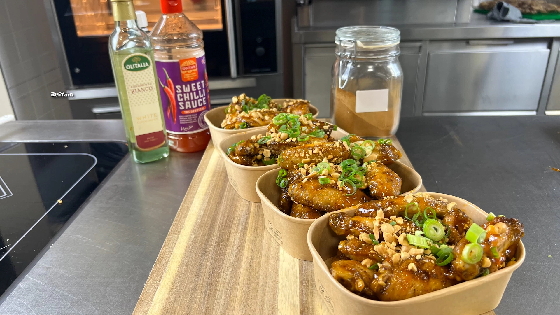 buffalo chicken wings finished with peanuts and spring onion