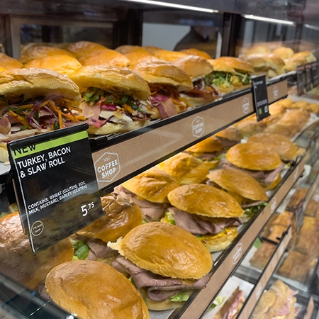 close up of cold sandwiches in frijado cold food display